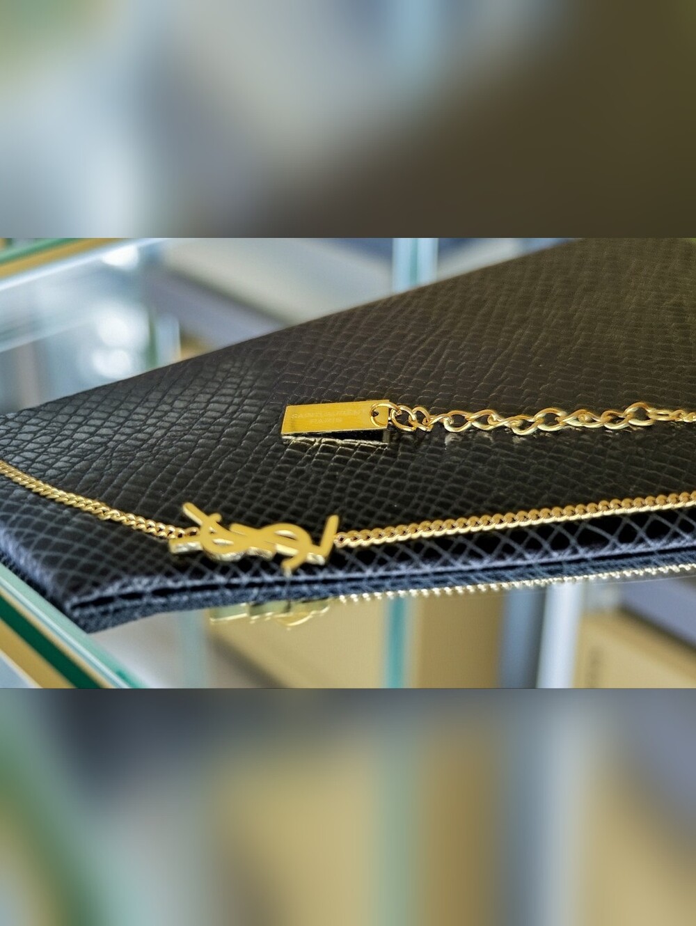 Yves Saint Laurent Black and Gold Logo Chain Bracelet
